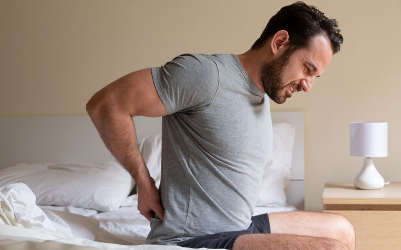 men having back pain image